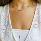 model wearing necklace with onys, ruby and sapphire birthstones
