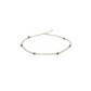 A layered silver anklet with natural sapphire gemstone beads