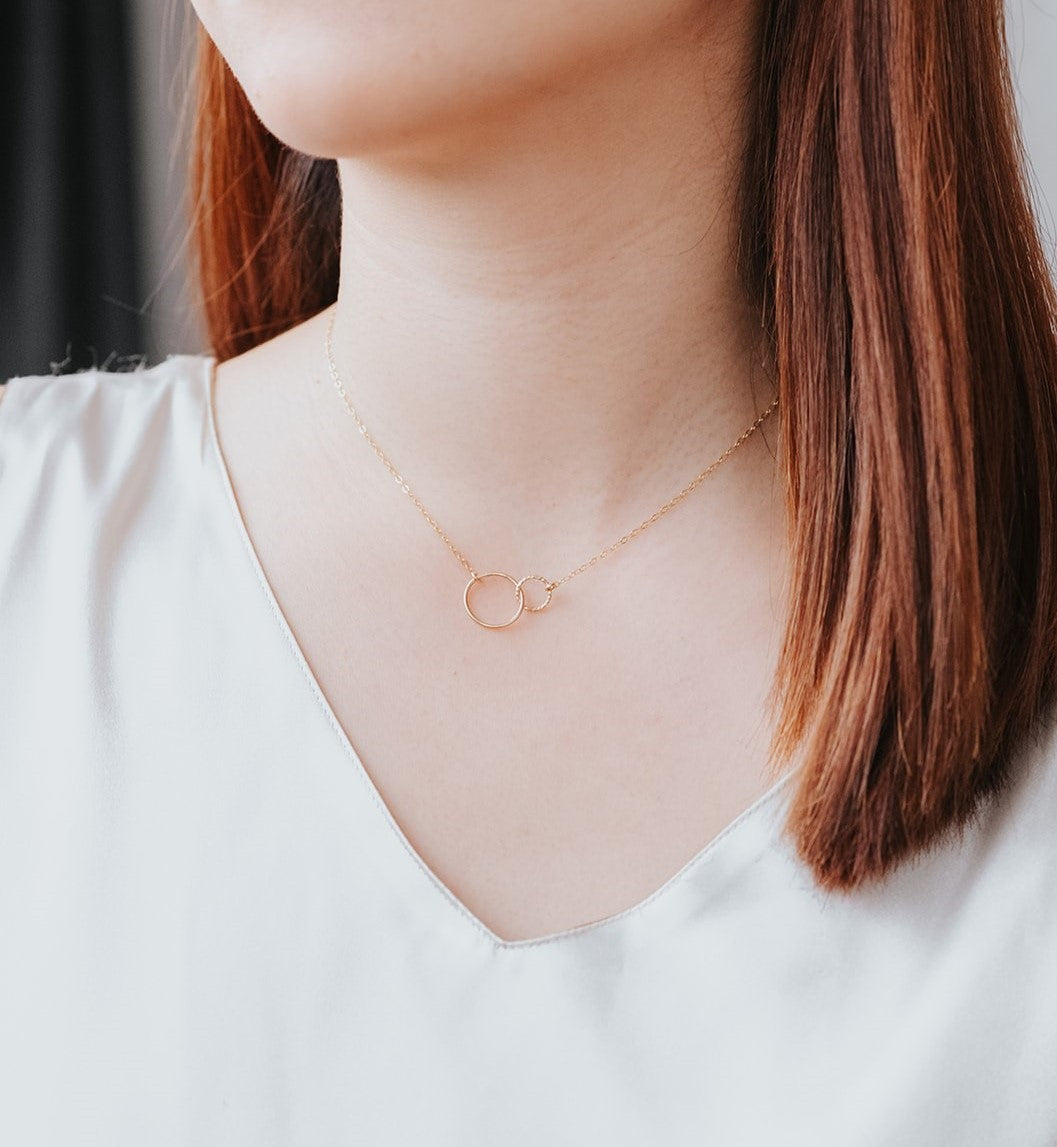 model wearing gold circle pendant friendship necklace