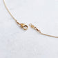 Gold necklace clasp and tag