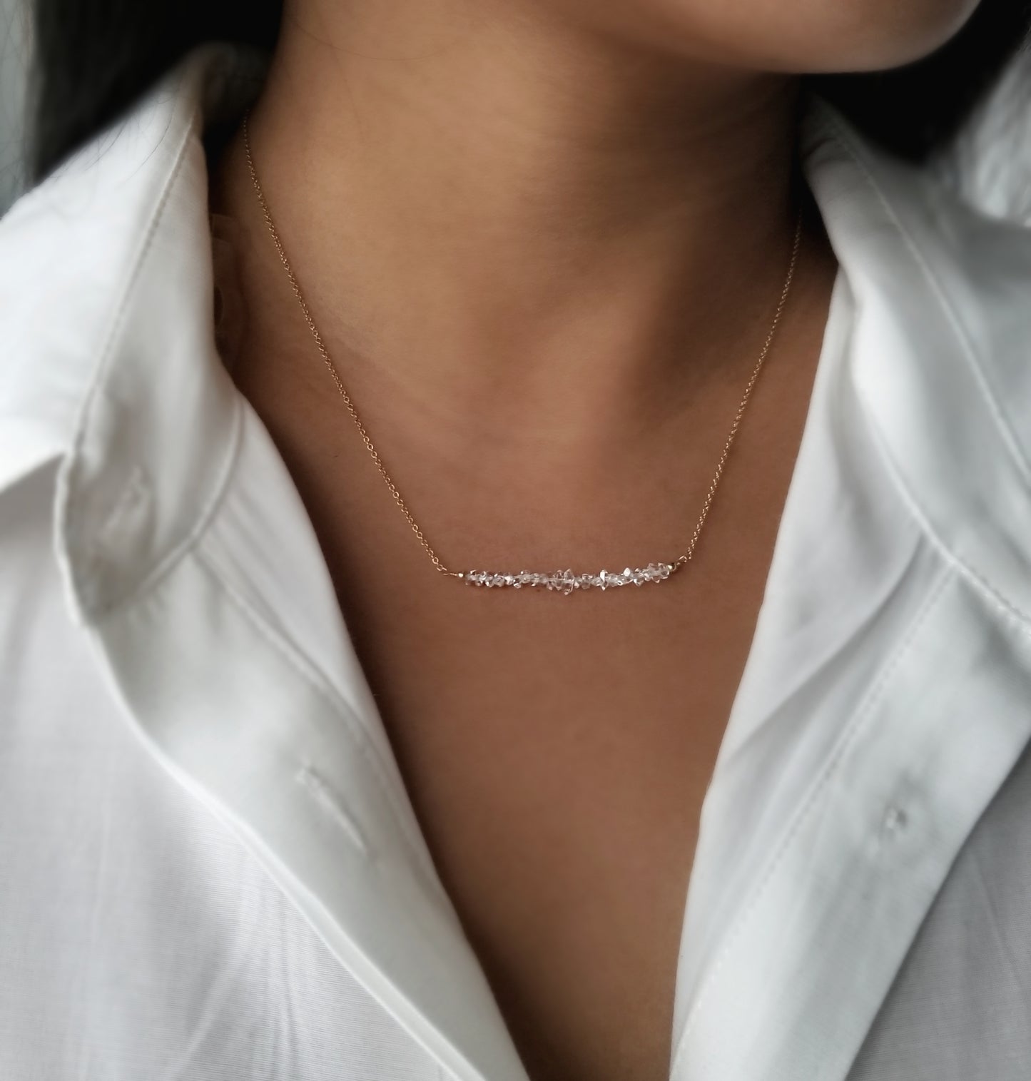 model wearing herkimer quartz bar necklace