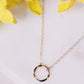 Gold circle short karma necklace