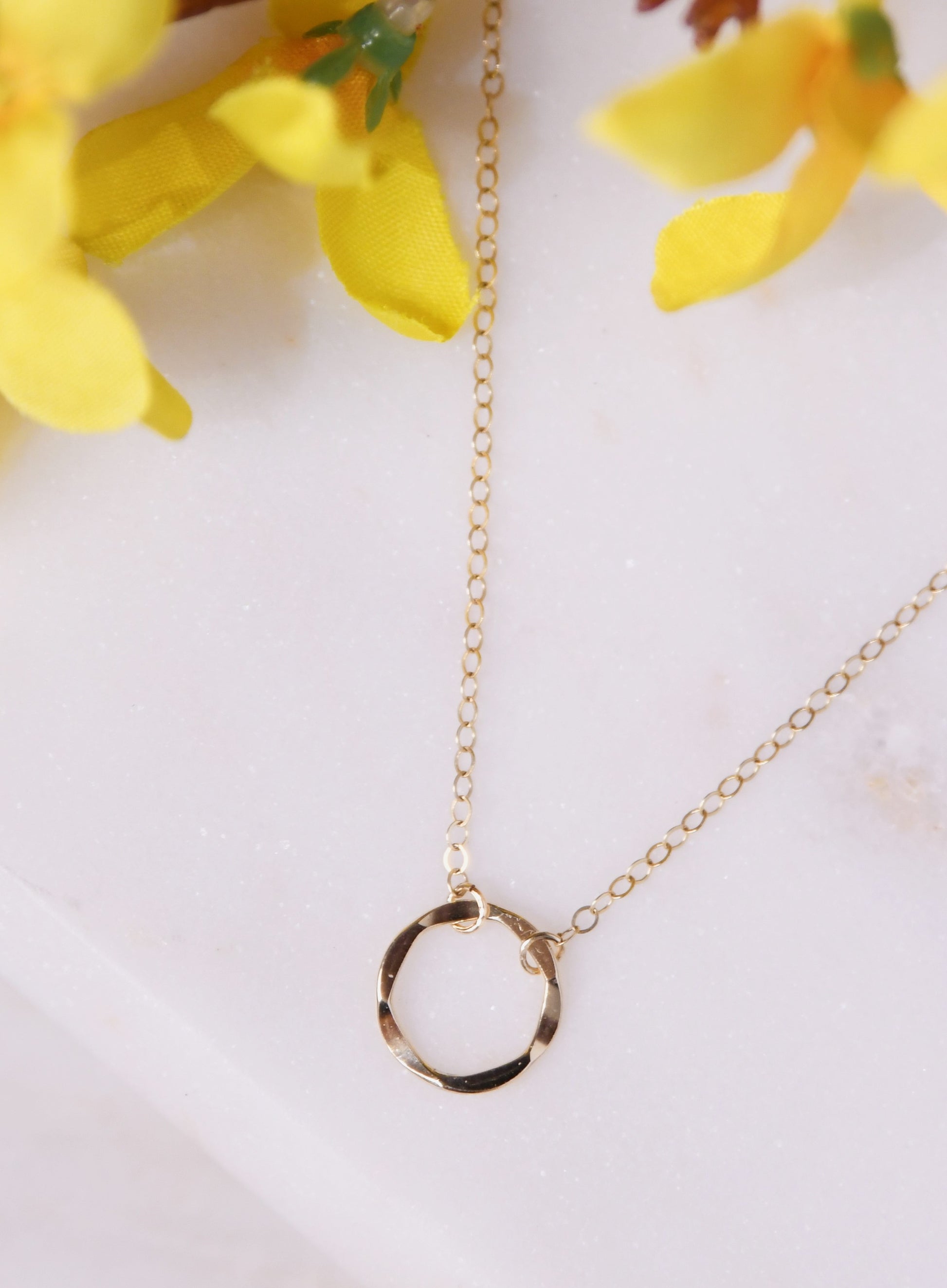 Gold circle short karma necklace